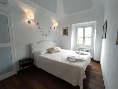 Letto o letti in una camera di Casa Mantegna
