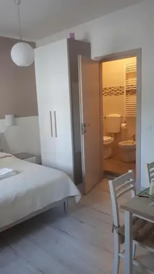 Letto o letti in una camera di Le camere di Sabrina con bagno in camera
