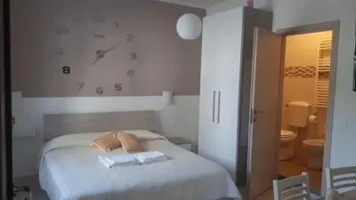 Letto o letti in una camera di Le camere di Sabrina con bagno in camera