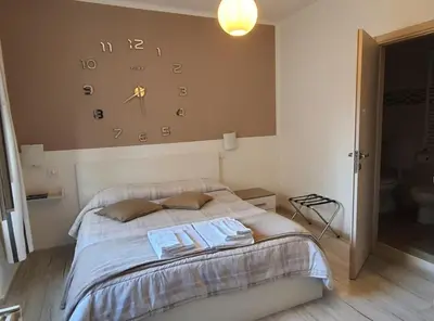 Letto o letti in una camera di Le camere di Sabrina con bagno in camera