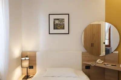 Letto o letti in una camera di Hotel Ristorante Alla Vittoria
