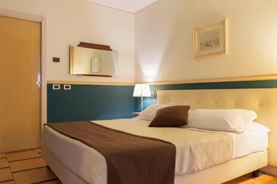 Letto o letti in una camera di Hotel Ponte di Rialto