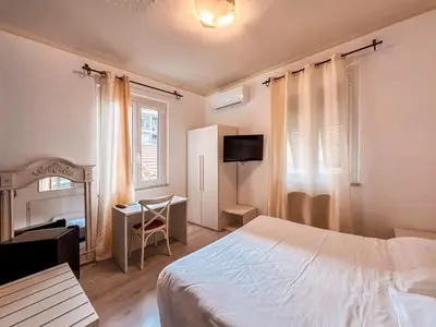 Letto o letti in una camera di Hotel Alba