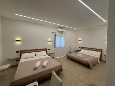 Letto o letti in una camera di Affittacamere La Casa Del Tiglio