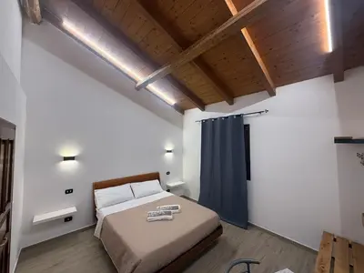 Letto o letti in una camera di Affittacamere La Casa Del Tiglio