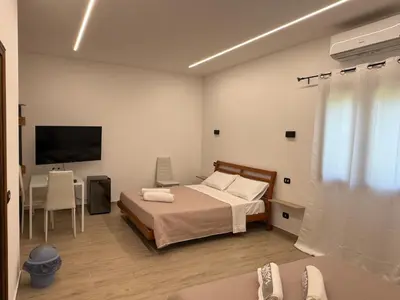 Letto o letti in una camera di Affittacamere La Casa Del Tiglio