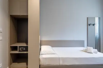 Letto o letti in una camera di Hotel Excelsior Pavia