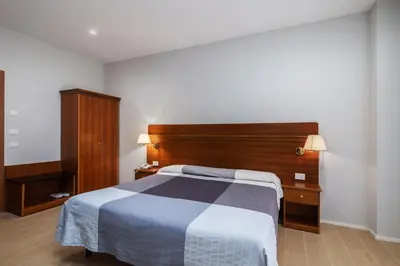 Letto o letti in una camera di Hotel Excelsior Pavia