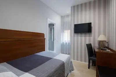Letto o letti in una camera di Hotel Excelsior Pavia