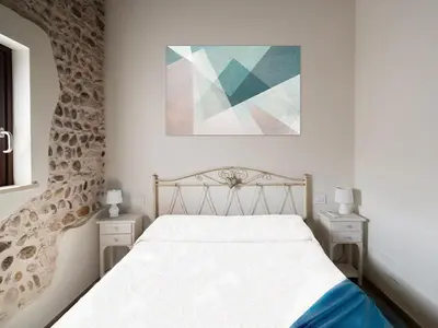 Letto o letti in una camera di La Piazzetta