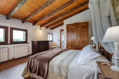 Letto o letti in una camera di Ca' del Monte Resort