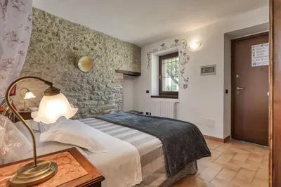 Letto o letti in una camera di Ca' del Monte Resort