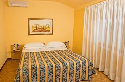 Letto o letti in una camera di Albergo Nazionale