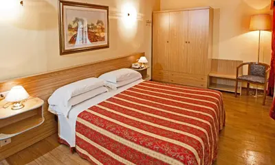Letto o letti in una camera di Albergo Nazionale