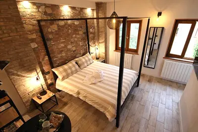 Letto o letti in una camera di LA MAESTA'