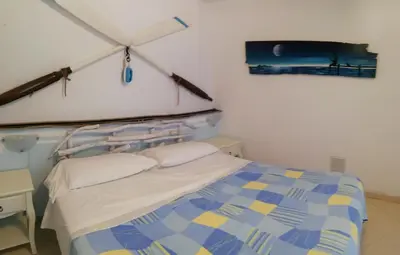 Letto o letti in una camera di APPARTAMENTO CON GIARDINO, TERRAZZO e GARAGE A DUE PASSI DAL MARE e DALLE CINQUETERRE