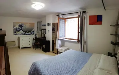 Letto o letti in una camera di APPARTAMENTO CON GIARDINO, TERRAZZO e GARAGE A DUE PASSI DAL MARE e DALLE CINQUETERRE
