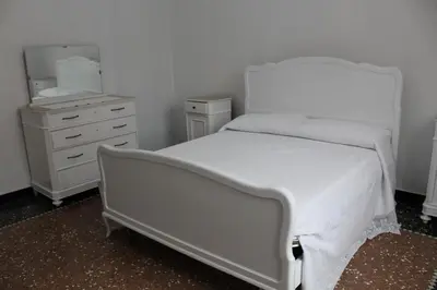 Letto o letti in una camera di Casa Orchidea