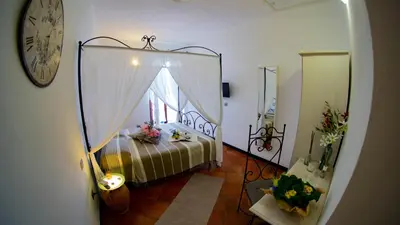 Letto o letti in una camera di Rooms and Breakfast da Carla