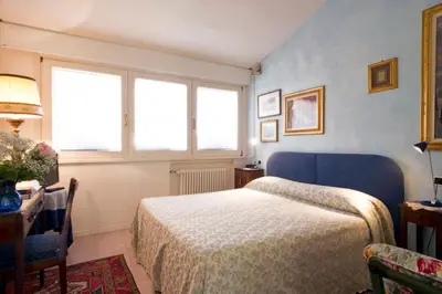 Letto o letti in una camera di Villa Bellaria B&B