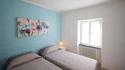 Letto o letti in una camera di Casa Gardan