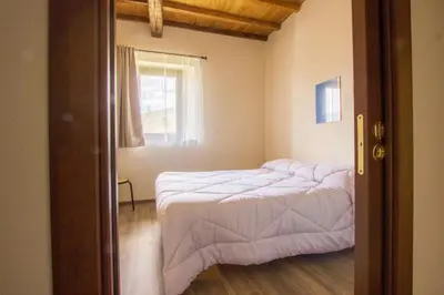 Letto o letti in una camera di Agripodere il Falco - Tuscany Nature & Relax
