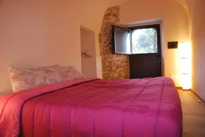 Letto o letti in una camera di Agripodere il Falco - Tuscany Nature & Relax