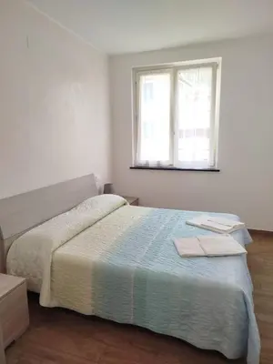 Letto o letti in una camera di Gloria House