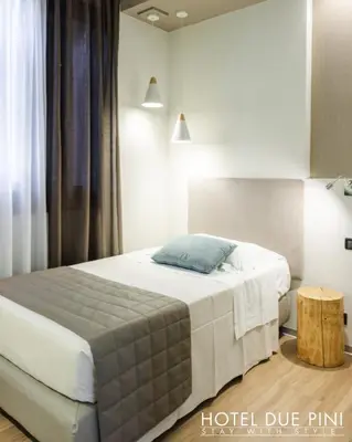 Letto o letti in una camera di Hotel Due Pini