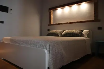 Letto o letti in una camera di Bed & Breakfast 1906