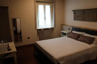 Letto o letti in una camera di Bed & Breakfast 1906