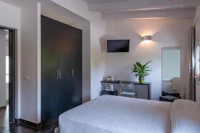 Letto o letti in una camera di Anima Mundi