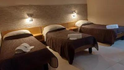 Letto o letti in una camera di Hotel La Torre