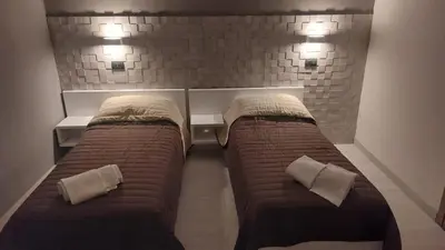 Letto o letti in una camera di Hotel La Torre