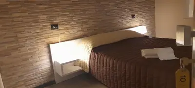 Letto o letti in una camera di Hotel La Torre