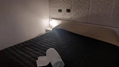 Letto o letti in una camera di Hotel La Torre
