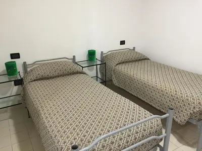 Letto o letti in una camera di Elicrim