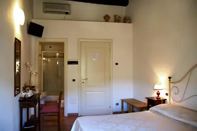 Letto o letti in una camera di L'Antica Pieve Bed & Breakfast