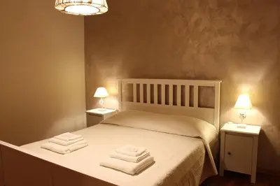 Letto o letti in una camera di B&B Villa dei Cigni Reali