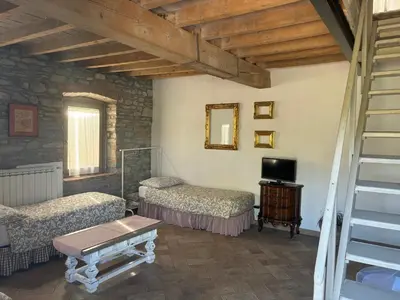 Letto o letti in una camera di UvaMatta