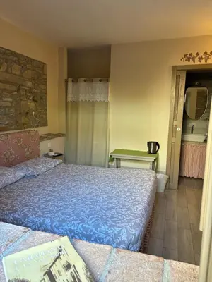 Letto o letti in una camera di UvaMatta