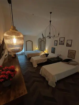 Letto o letti in una camera di Garda Relais Antica Romelia