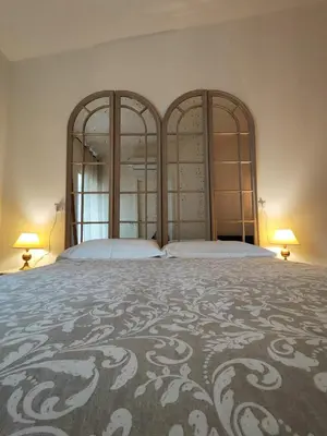 Letto o letti in una camera di Garda Relais Antica Romelia