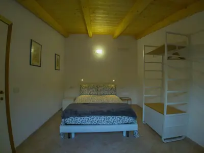 Letto o letti in una camera di Appartamento Il Fattore