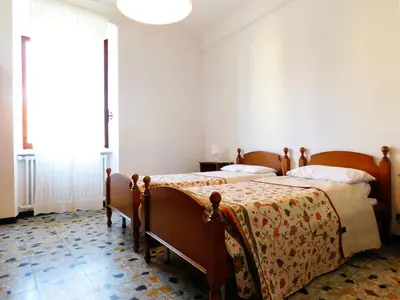 Letto o letti in una camera di Le stanze del papa, Levanto