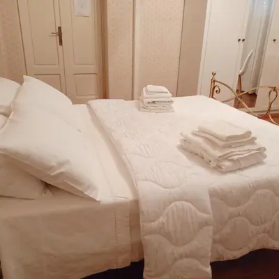 Letto o letti in una camera di La Casa di Tino