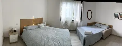 Letto o letti in una camera di Senza Pensieri via Viviani
