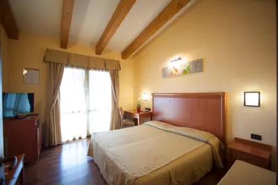 Letto o letti in una camera di Hotel Regio