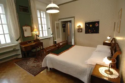 Letto o letti in una camera di Palazzo Arrivabene B&B