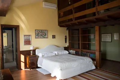 Letto o letti in una camera di Palazzo Arrivabene B&B